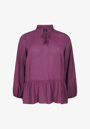 Lilla pika varrukatega pluus, millel on volangiga kaelus, avatud kaelus ja peplum-sinine; valmistatud kerge kehaga tekstuuriga kangast.