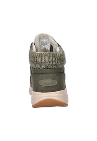 Groene waterdichte Skechers-boots met een gebreide manchet, zachte voering en een gevoerde zool. Beschikt over een gladde bovenkant en een gestructureerde hiel.