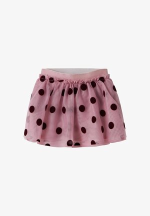 Jupe tutu rose avec de gros pois noirs, taille élastique et tissu transparent en couches.