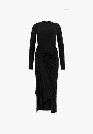 Zwart lange mouwen jurk met een ronde halslijn. Beschikt over gedrapeerde details bij de taille en een kuitlange zoom met een zijsplit. Gemaakt van zachte stof.