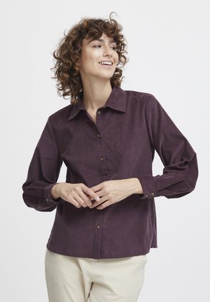 Lila Cord-Hemd mit Kragen, langen Ärmeln und Manschetten. Verfügt über einen geraden Saum und strukturierten Stoff.