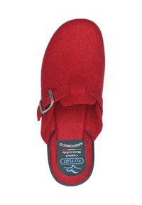 Red felt clogs with a round toe, adjustable metallic buckle, and cushioned insole. Black outsole with branding on the footbed.