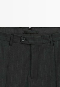 Dark grey tailored pants featuring a pinstripe pattern, button closure, belt loops, and a smooth texture suitable for formal wear.