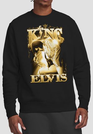 Black sweatshirt showing gold-toned graphic of Elvis Presley singing, with large text "King Elvis" above and below the image.