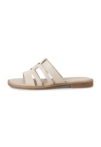 Beige slide sandal with three wide straps. Material appears smooth, with a flat, light brown sole and subtle stitching details.