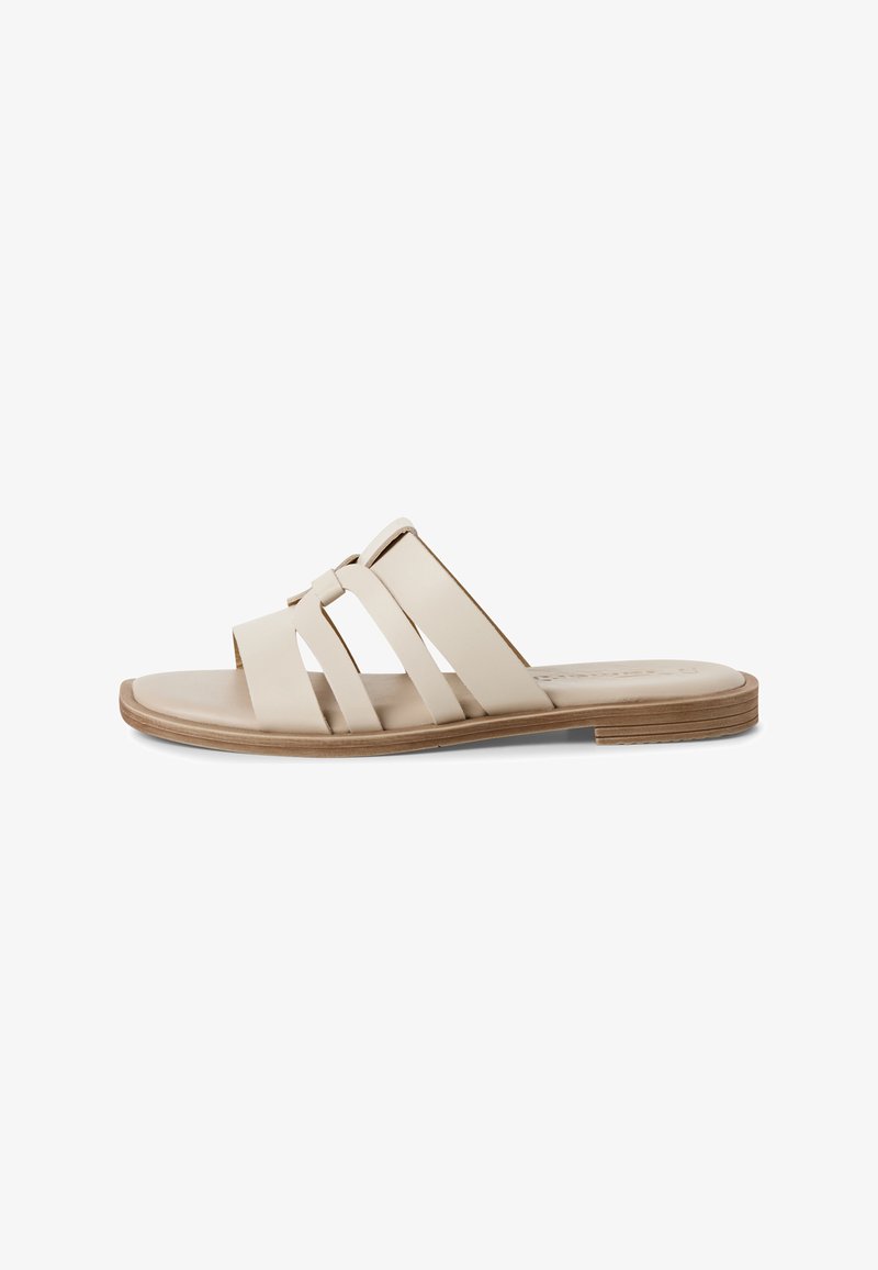 Beige slide sandal with three wide straps. Material appears smooth, with a flat, light brown sole and subtle stitching details.