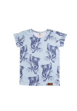Light blue children's t-shirt with short sleeves, featuring a repeated dark blue koala bear pattern and shoulder snap buttons.