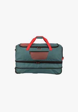 Large teal duffle bag with red accents, black zippers, and a textured brown pocket. Features dual handles and a wheeled base for mobility.