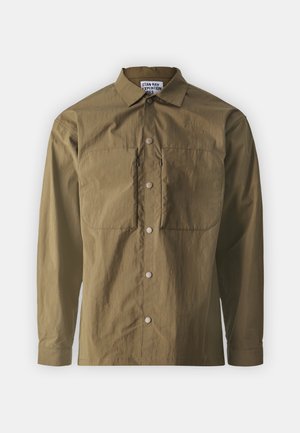 Long-sleeve, olive-green shirt made of lightweight fabric. Features a point collar, front button closure, and two chest pockets with flaps.