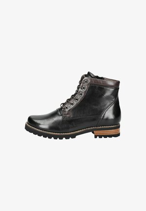 Bottine en cuir noir avec une finition brillante, accents marron, six œillets et une semelle robuste. Coutures détaillées et design de talon contrastant.