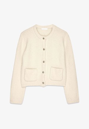 Kremowy sweter z dzianiny z okrągłym dekoltem, długimi rękawami, srebrnymi spiralnymi guzikami oraz dwiema przednimi kieszeniami. Teksturowana tkanina o skróconym kroju.