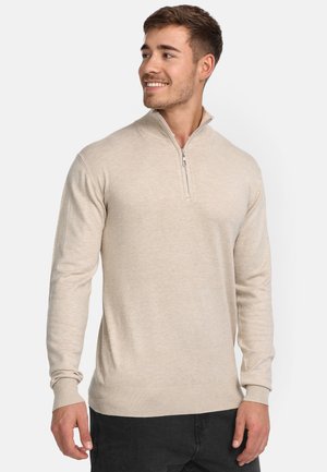 Helle beige Zip-up Sweatjacke mit langen Ärmeln, gerippten Bündchen und Saum. Weicher Stoff, taillierte Silhouette, minimalistisches Design.