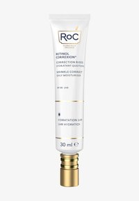 Tube cylindrique blanc avec des accents dorés, étiqueté "Roc Retinol Correxion." Contient 30 ml de crème hydratante quotidienne avec SPF 30.