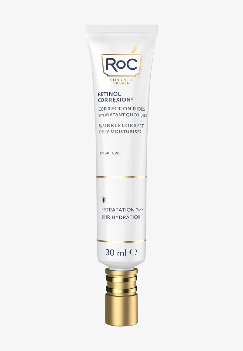Tube cylindrique blanc avec des accents dorés, étiqueté "Roc Retinol Correxion." Contient 30 ml de crème hydratante quotidienne avec SPF 30.