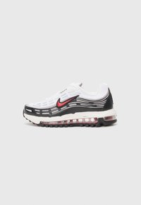 Bela Nike Air Max teniska z obliko v črni in rdeči barvi, z vidno zračno enoto, mrežastim zgornjim delom in vzorčnim podplatom. Gladka tekstura, športen videz.