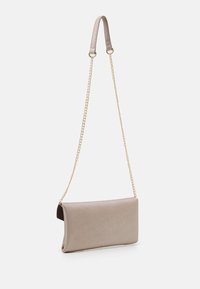 Clutch bag in beige textured material with a flat rectangular shape. Features a gold chain strap and a smooth finish.