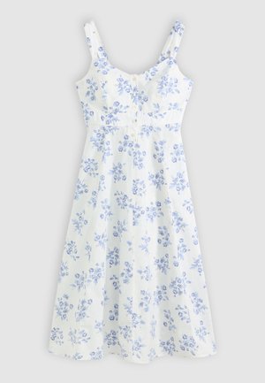 White sleeveless midi dress with blue floral print and buttons down the front, featuring a fitted bodice and flared skirt.