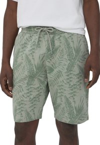 Pantaloni corti leggeri da uomo in tessuto verde chiaro con motivo palme, dotati di cintura elastica e chiusura con cordino.