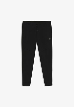 Czarne sportowe dresy wykonane z miękkiego, elastycznego materiału. Posiadają regulowany pas, zwężane nogawki i skośne szwy. Logo w kształcie heksagonu na udzie.