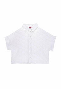 Camicia bianca corta con colletto a punta, caratterizzata da ricami floreali e una chiusura frontale con bottoni. Maniche corte con una vestibilità rilassata.