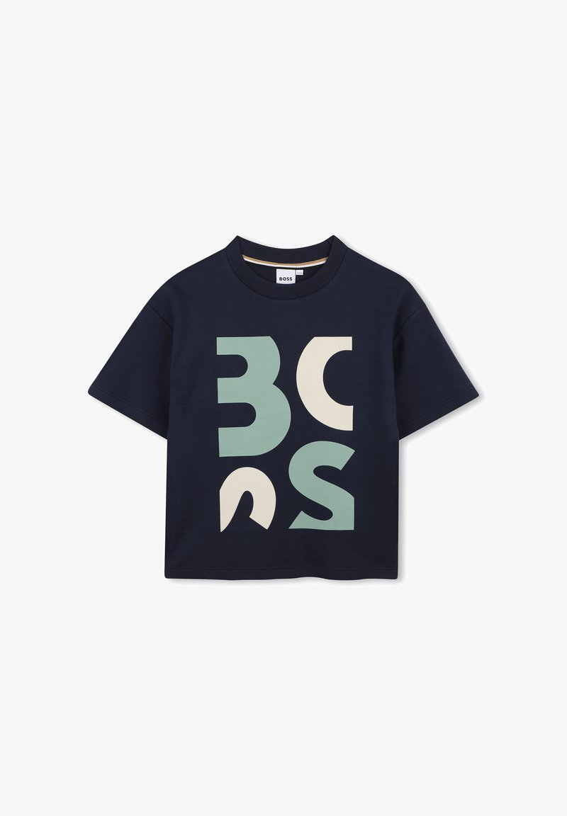 T-shirt à manches courtes bleu marine avec de grandes formes géométriques en vert menthe et crème. Fabriqué en coton doux avec un col rond.