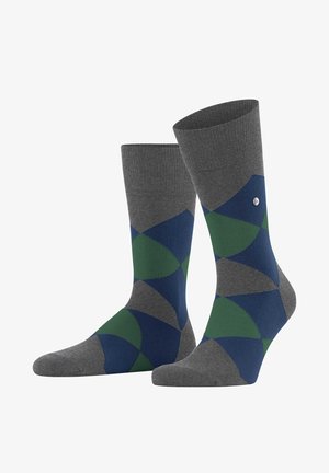 Graue Socken mit einem geometrischen Muster in Marineblau und Grün, mit einem gerippten Bündchen und einem kleinen silbernen Logo-Detail.