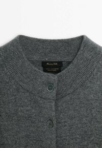 Gray wool cashmere cardigan with ribbed collar, featuring two dark buttons and label detailing. Soft texture, simple design.