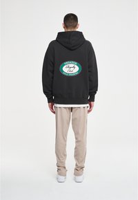 Pegador LOGO PANTS UNISEX - Joggebukse - taupe/black