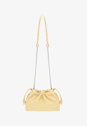 Light beige drawstring leather shoulder bag with silver chain strap and extended beige leather shoulder pad.