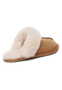 Brown suede slipper with a fluffy cream shearling cuff. Features a flat tan rubber sole and stitched seams. Soft texture throughout.