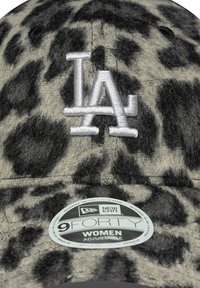 Gray and black leopard print cap made of soft fabric, featuring an embroidered "LA" logo and an adjustable strap with a black label underneath.