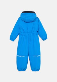 Μπλε, ελαφρύ χιτώνιο χιονιού με κουκούλα, ελαστική μέση και ελαστικούς καρπούς. Διαθέτει λευκές οριζόντιες ρίγες στις τσέπες.