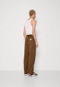 Carhartt WIP SIMPLE PANT - Relaxed fit jeans - dark brown