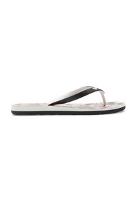 Svart och vit flip-flop med blomsterdesign på sulan, med smala remmar och en texturerad gummiyta.