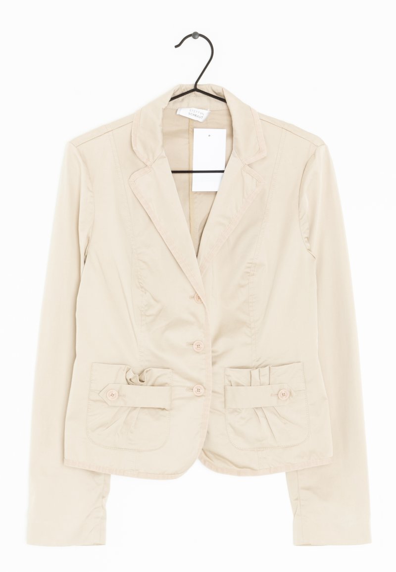 Béžové sako s členitými klopami a dvěma předními kapsami. Má jednorehé knoflíky a nashromážděné detaily na kapsách. Bavlněná směsová látka.
