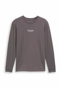 Tumšā pelēkā krāsā kokvilnas krekls ar garām piedurknēm, apaļo kakla izgriezumu un piedurkņu aprocēm. Uz krūtīm ir balts izdrukāts logotips.