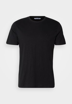 T-shirt nero a maniche corte realizzato in morbido cotone. Presenta un collo a giro e un logo sottile in ricamo tonale sul petto.
