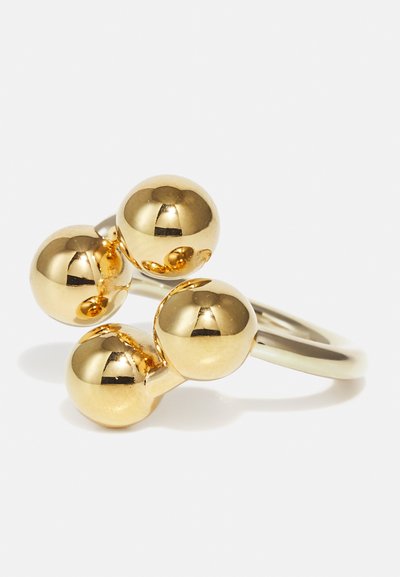 Gouden ring met drie gepolijste bolvormige accenten op een gladde band. De bollen verschillen iets in grootte en hebben een glanzende afwerking.