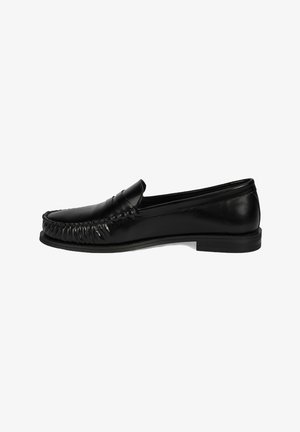 Black leather loafers with a moccasin design, featuring a rounded toe, decorative stitching, and a slight heel. Smooth texture throughout.