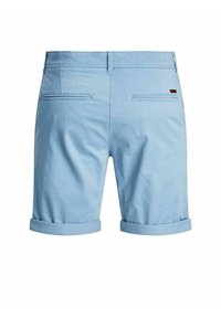 Light blue shorts made of smooth fabric, featuring folded cuffs, two back pockets, and a small leather accent on the waistband.