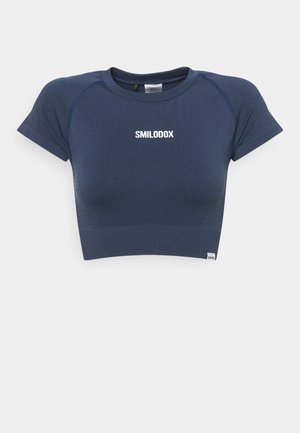 Navy blue fitted crop top with short sleeves and "SMILODOX" printed in white on the chest.