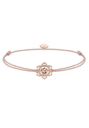 Regulowana bransoletka na sznurku w kolorze różowego złota z zawieszką w kształcie kwiatu lotosu i małymi przezroczystymi kryształkami na środku, minimalistyczny i elegancki design.