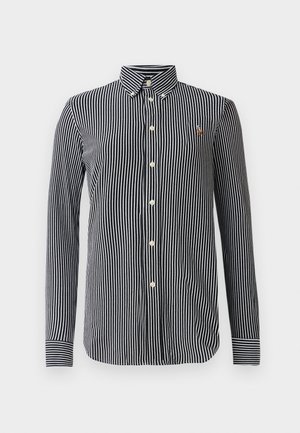 Striped button-up shirt in navy and white, featuring a classic collar, long sleeves, and a small logo emblem on the chest.