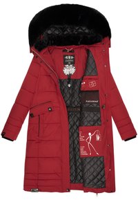 Red puffer coat with a detachable black fur-lined hood, quilted interior, multiple pockets, and sustainability labels on the inside.