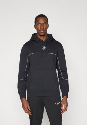 Hoodie noir en mélange de coton avec des détails de piping blanc. Dispose d'une poche avant, d'une capuche avec cordon de serrage et d'un logo circulaire sur la poitrine.