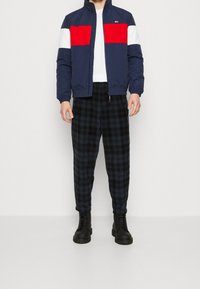 Tommy Jeans Allvädersjacka - dark blue