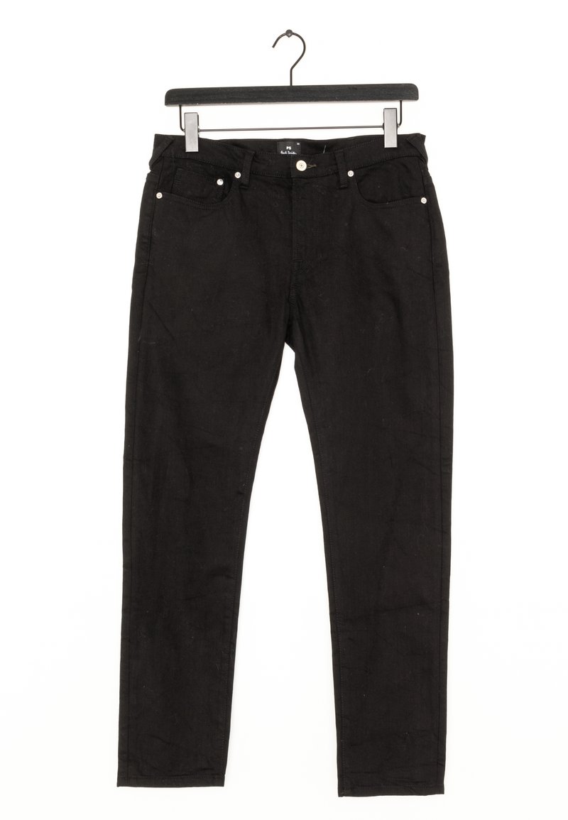 Jean noir slim avec poches avant et fermeture par boutons, suspendu à un cintre noir sur fond blanc.