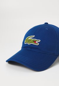 Lacoste Sapka - globe