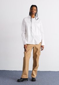 The North Face HIGH LOW - Pogājama blūze - white