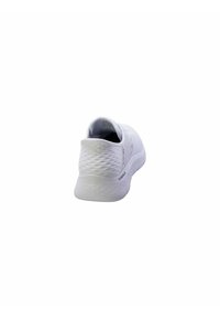 White athletic shoe featuring a textured mesh upper and a contoured sole. Simple design with a low profile and a padded heel collar.